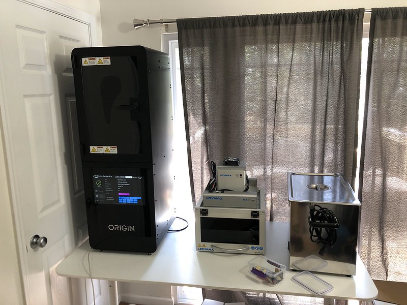 Our new Origin 3D printer and wash station setup at home.